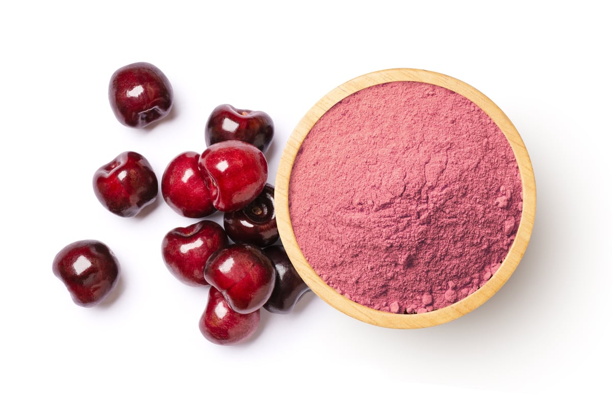 Cherry powder on white background. Overhead view