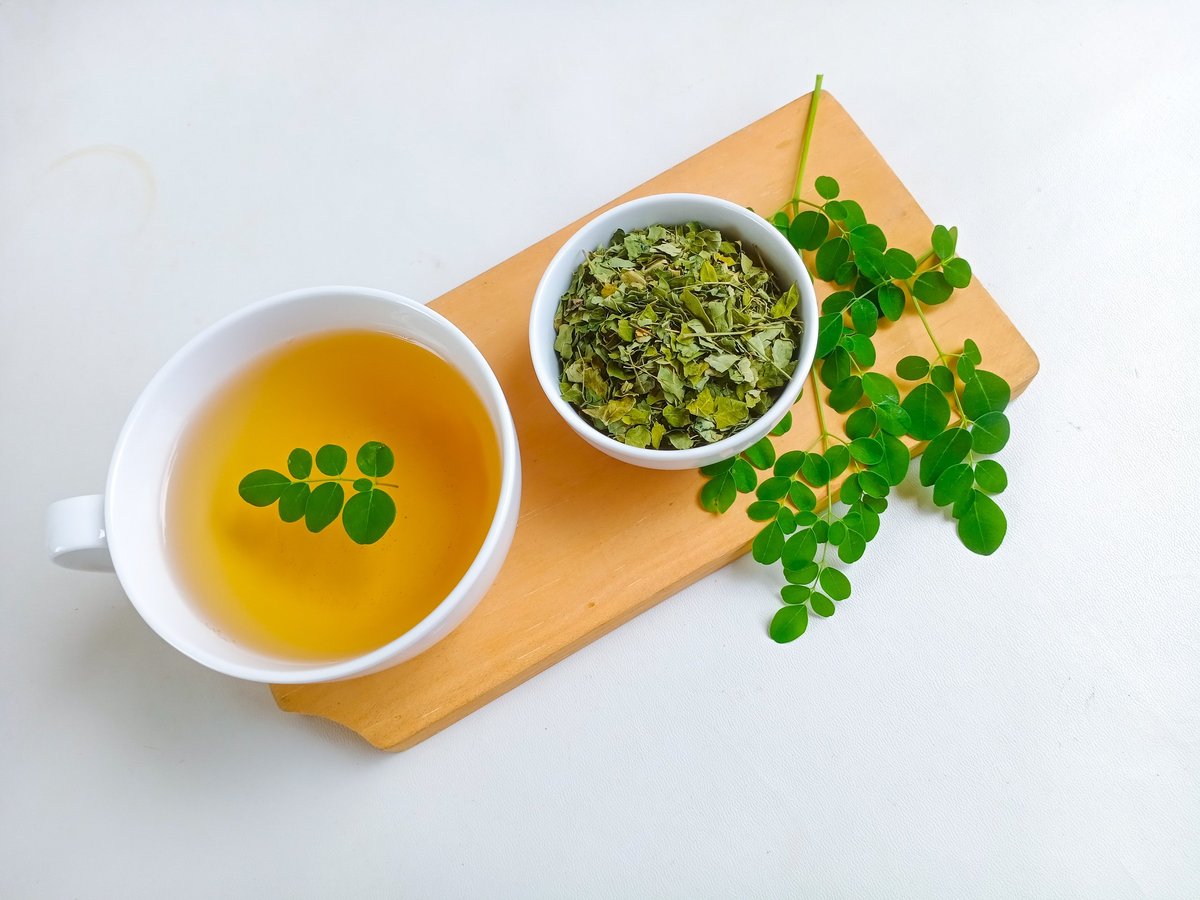 Moringa or Daun kelor herbal drink. A cup of Moringa tea.